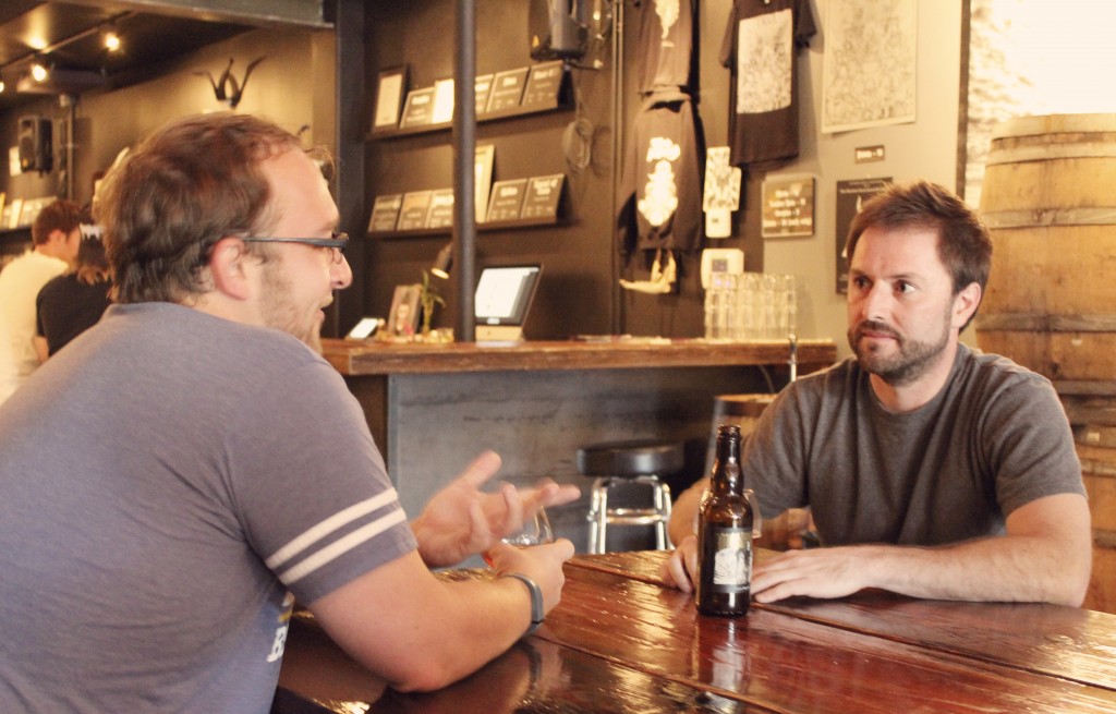 Adam talks with Brady at Trve Brewing Company. Photo by Desiree Duzich