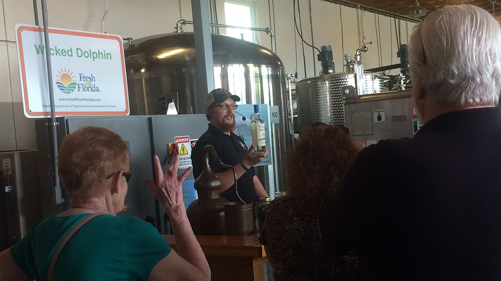Assistant distiller Matt Loiselle gives a packed tour of Wicked Dolphin.