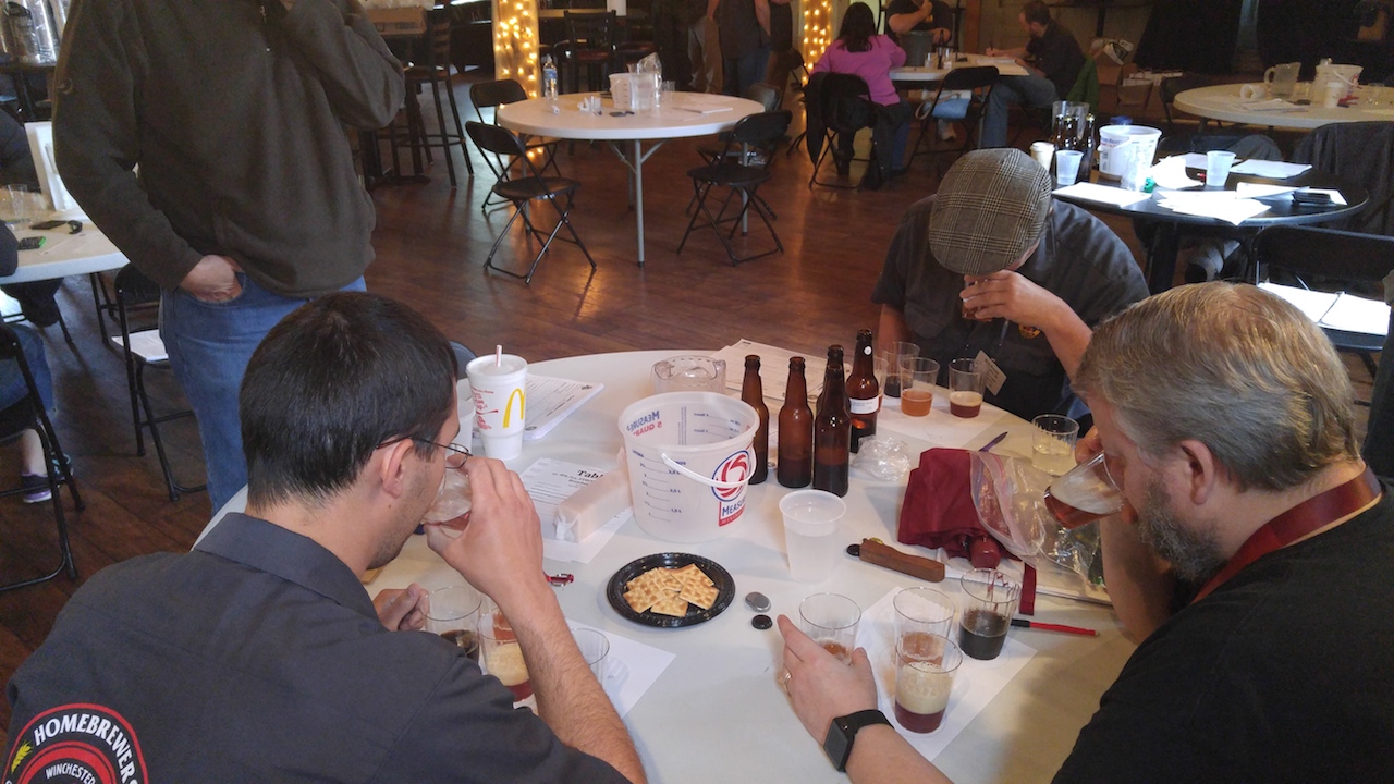 (Certified Judges hard at work deciding "Best of Show" winners in IPA Category; Photo by Scott Johnson)